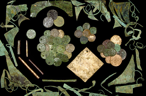 Fig. 5. Copper scrap, coins, jettons, and tubular beads from Fort James (courtesy APVA Preservation Virginia).