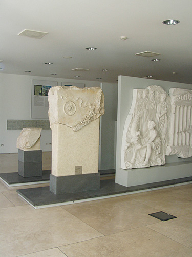 Fig. 4. Installation view of basement gallery with original marble fragments and plaster casts of reliefs from a Claudian Roman altar, mid first century C.E. (courtesy Sovraintendenza ai Beni Culturali del Comune di Roma).