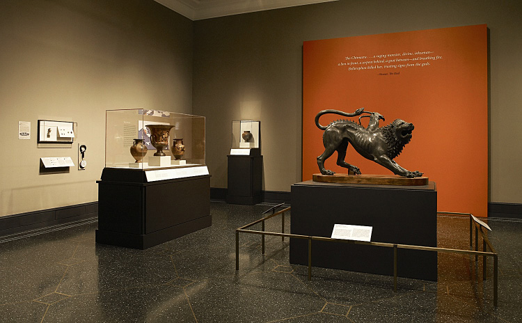 Fig. 1. Installation view of the exhibition: right, the Chimaera of Arezzo; left, cases with ancient vases, gems, and finger rings (E.M. Rosenbery).